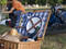 A generic shot of a picnic basket with plates, cutlery, bread an