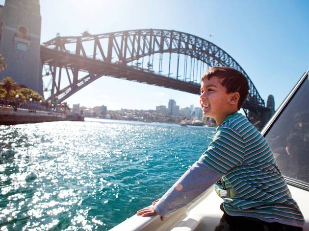 Young boy looking over Sydney harbour