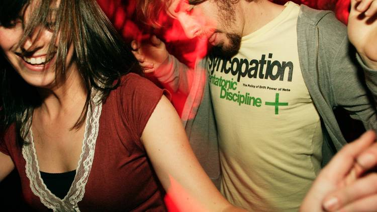 A generic image of two people dancing at a night club.