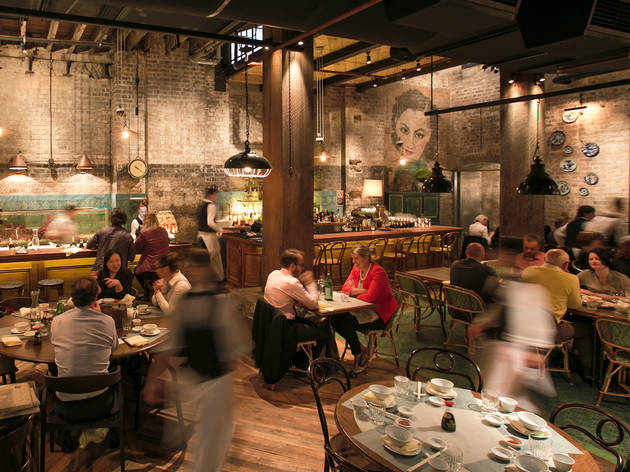 Dining room at Mr Wong Waiters rushing around in a dining room
