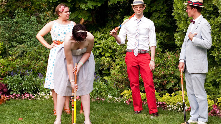 People playing croquet in the sun