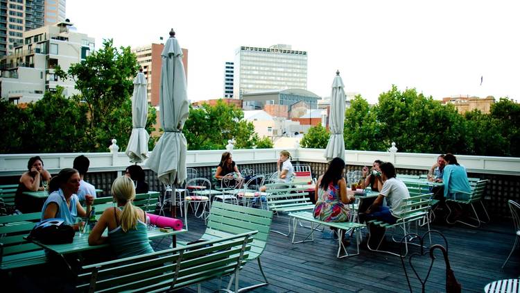 A shot of the rooftop at Madame Brussels showing people sitting