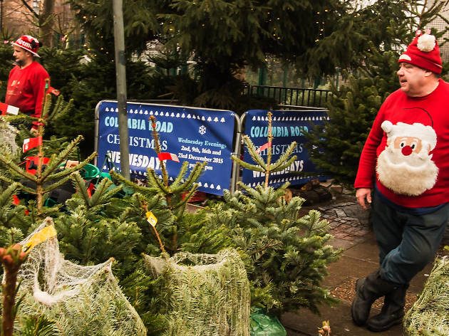 Two Christmas tree salesmen take a breather. Two Christmas tree salesmen take a breather.
