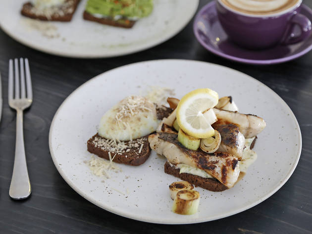 Toast + grilled honeyed sea bass + leeks + poached egg + feta cheese + toasted nuts at THIRDWAVE Toast + grilled honeyed sea bass + leeks + poached egg + feta cheese + toasted nuts at THIRDWAVE