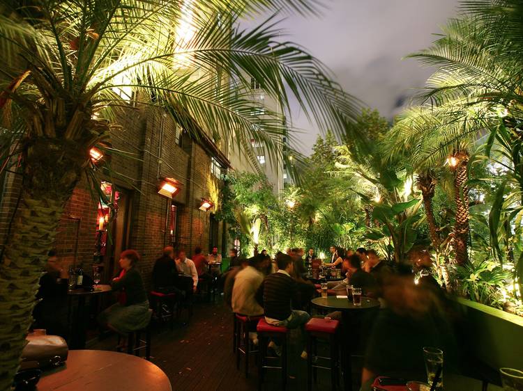 An exterior shot of a balcony area at Carlton Club showing peopl