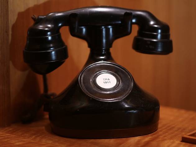 Vintage telephone at Bar Exuberante A vintage black telephone on a table at Bar Exuberante