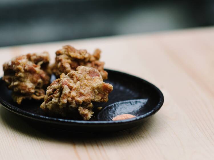 A plate of three pieces of fried chicken at Hakata Gensuke