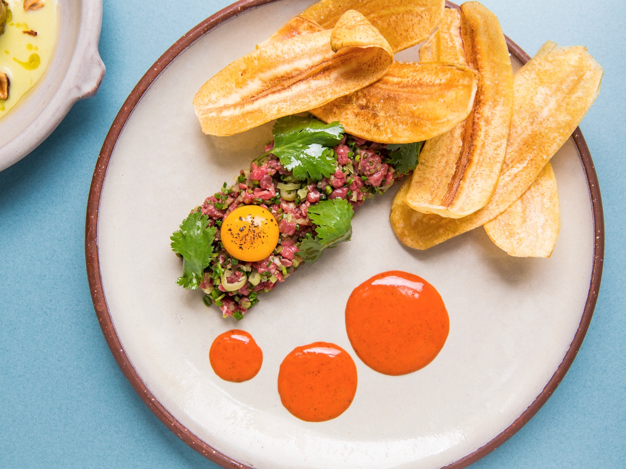 Five Star Restaurants In Sydney Steak Tartare Served With Plantaine Chips And A Raw Egg Yolk