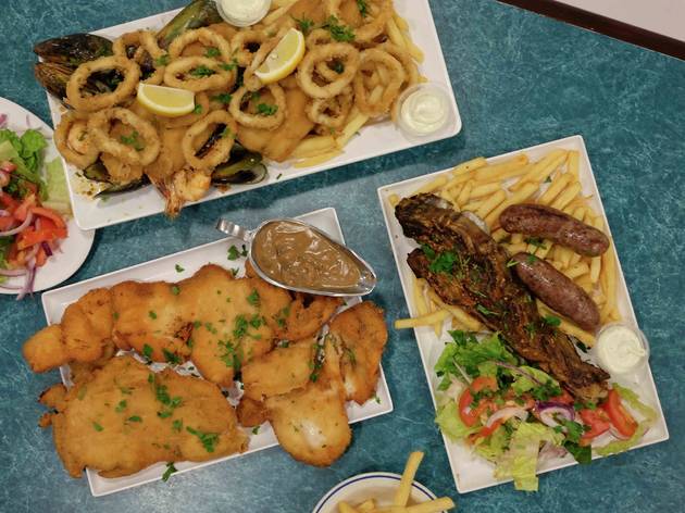 Food at The Goni's Schnitzelria An Array of foods on a blue table