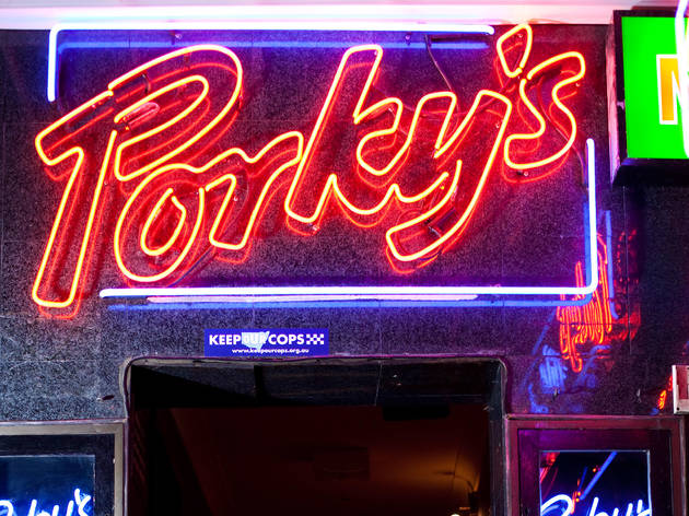 Signage at Porky's Nite Spot A neon sign reads "Porky's"
