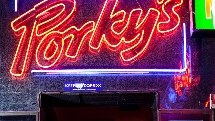 A neon sign reads "Porky's"