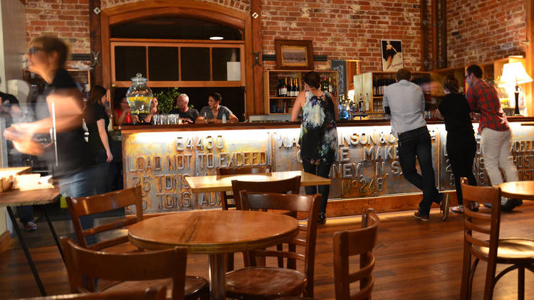 People waiting at the bar to be served