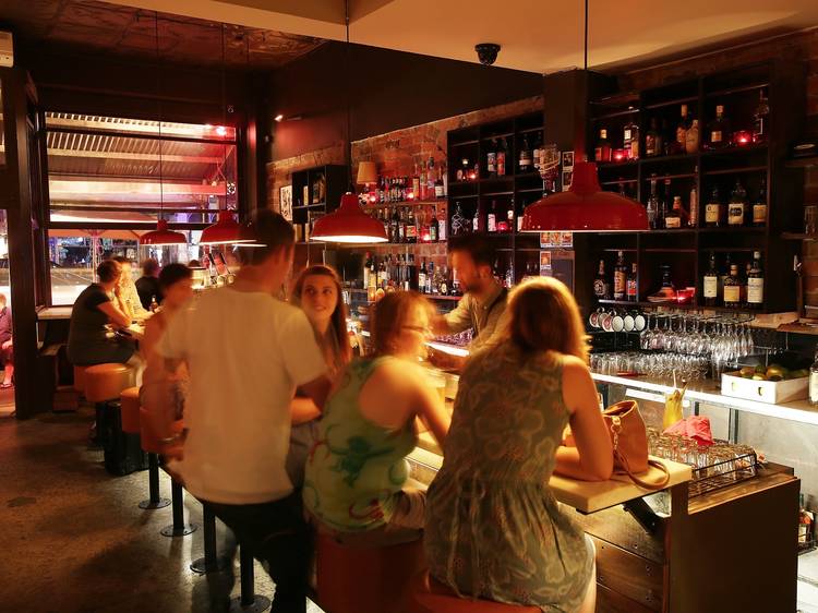 People sitting in a busy bar