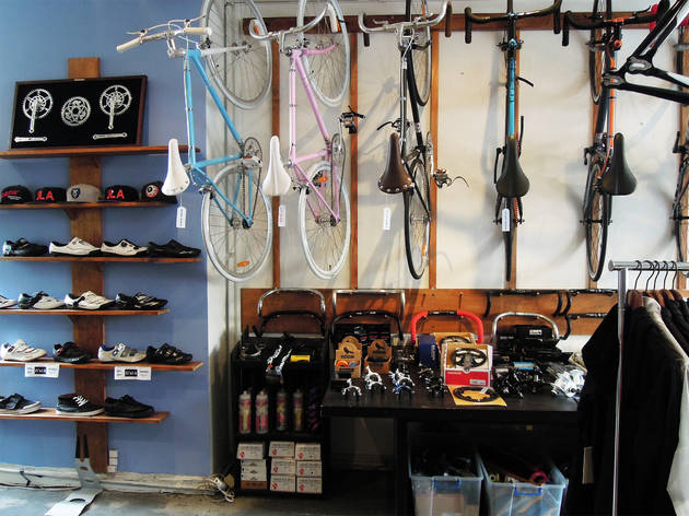 Bikes at Saint Cloud Bikes hang on the wall in a bike shop