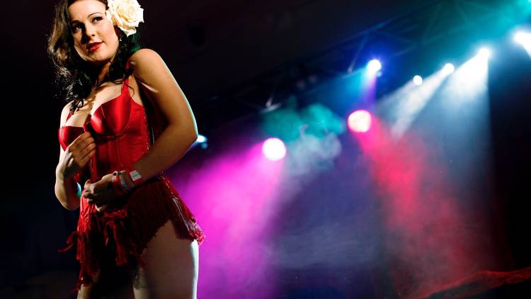A shot of a female burlesque performer on stage