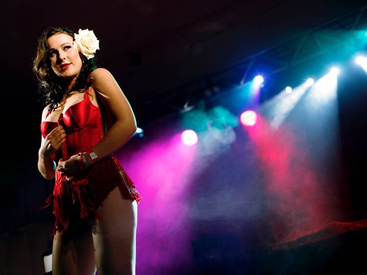 A shot of a female burlesque performer on stage