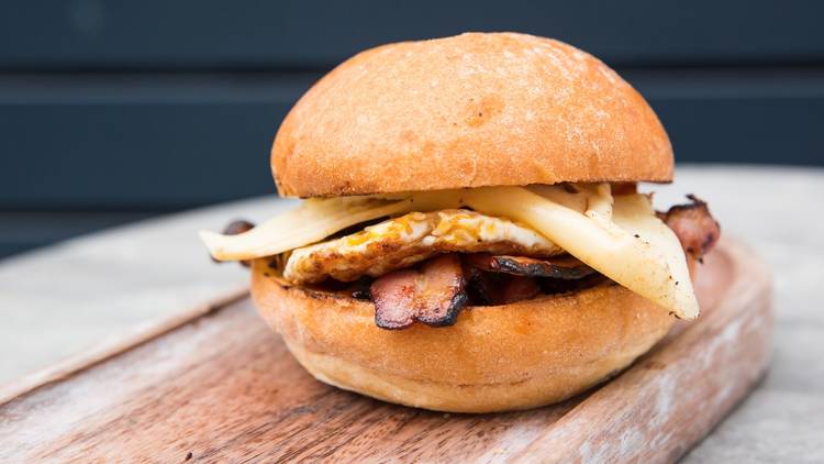 A close up shot of a bacon and egg roll at Antidote Coffee