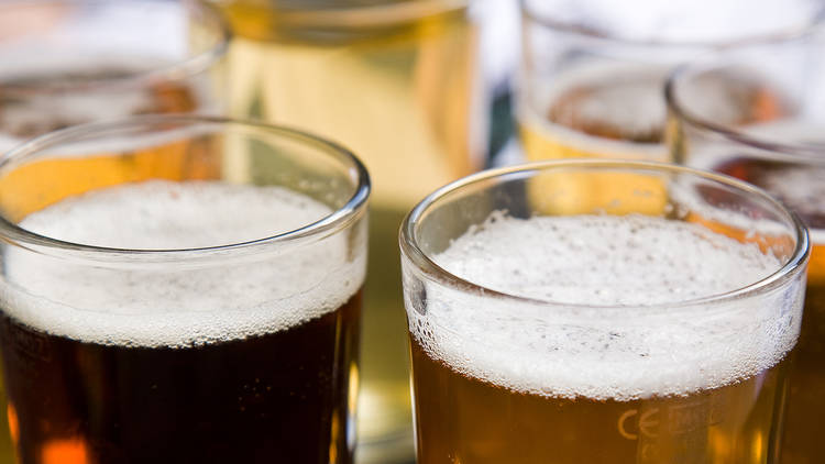 A close up shot of 6 glasses full of beer