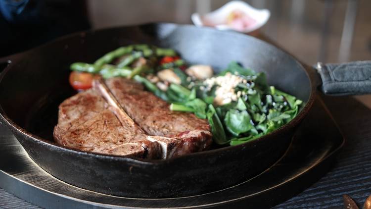 steak with vegetables on a pan