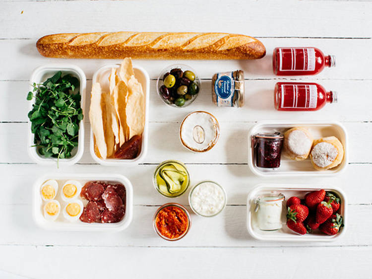 A picnic set laid out on a wooden table from The Floury Baker