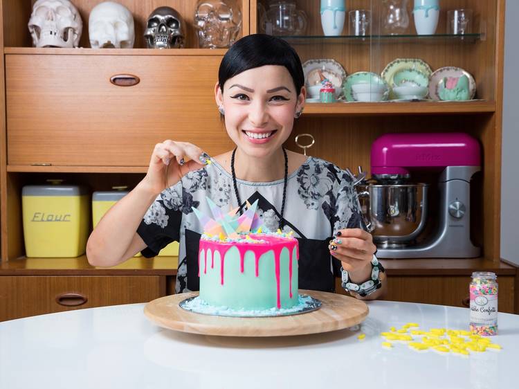 Katherine Sabbath places the finishing touches on one of her famous cakes