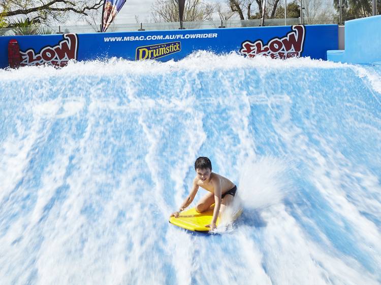 Catch a gnarly wave on a surfing simulator