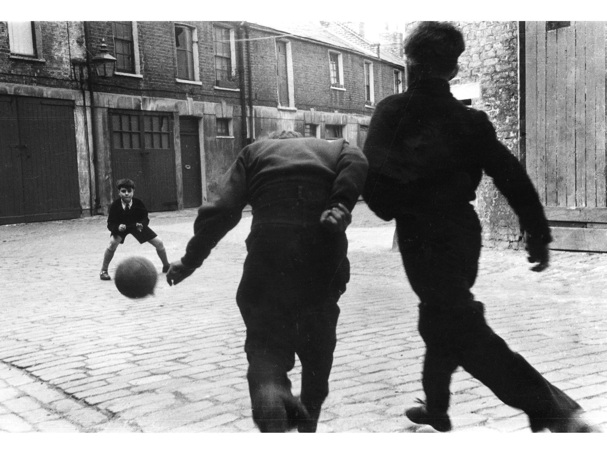 Best London photos: Roger Mayne: Football, Addison Place, North Kensington, 1956. © Roger Mayne/Mary Evans Picture Library