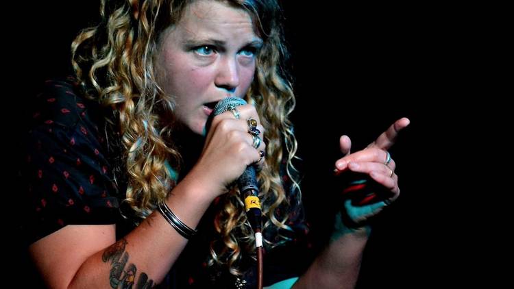 Kate Tempest performing on stage