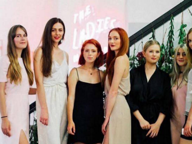 The Ladies Network Eight members of the Ladies Network stand together in front of a pink wall with their logo on it