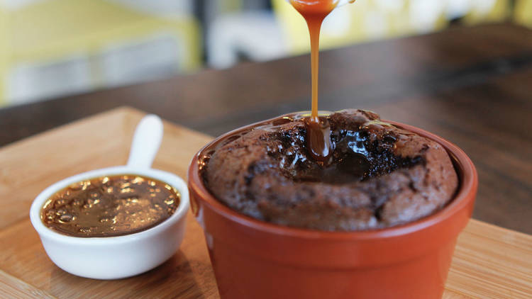 caramel poured over chocolate souffle