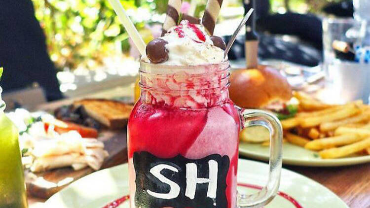 red velvet cake shake in a mason jar mug