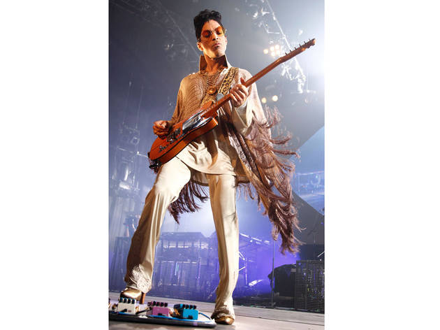 2011, Rotterdam, Netherlands. Beige snakeskin fringed poncho with a sci-fi collar for his Welcome 2 Europe tour.