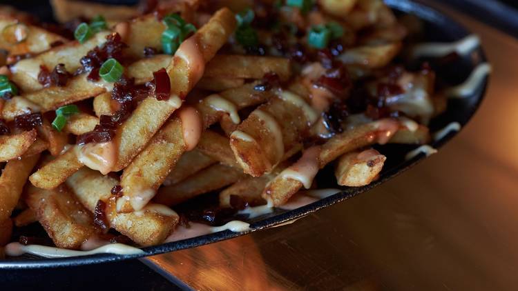 chips topped with cheese and chives