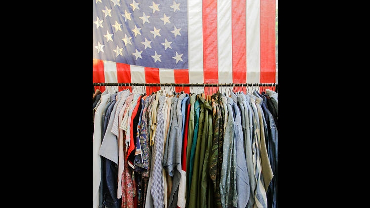 a rack of clothes at What's Vintage