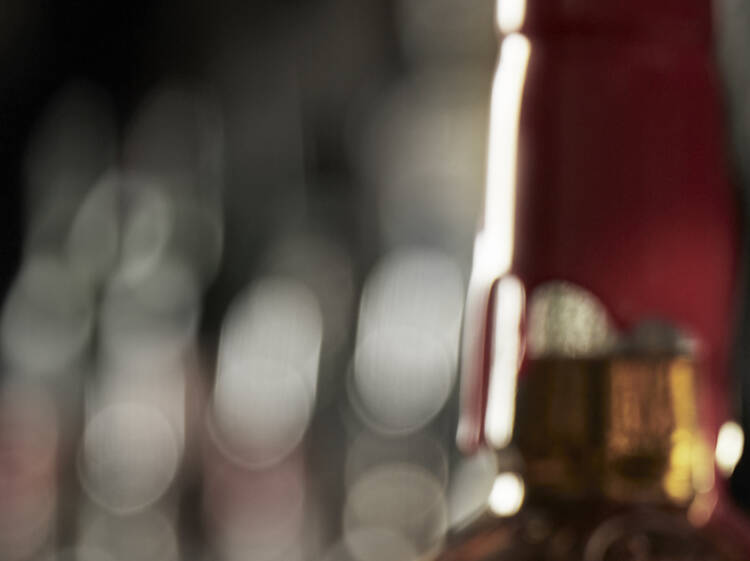 A Maker's Mark Old Fashioned cocktail being made on a bartop