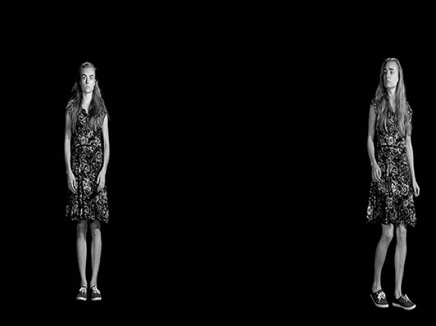 iCinema at UNSW a girl standing in front of a blank screen, appears twice