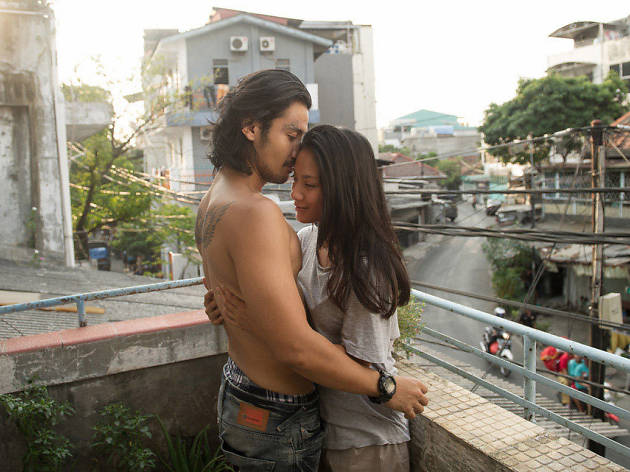 A Copy of My Mind Man and woman embrace on a balcony overlooking a crossroads