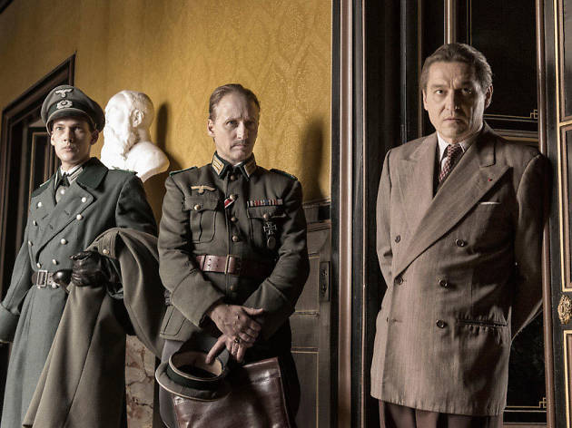 Francofonia Three men in official uniforms in front of doorway