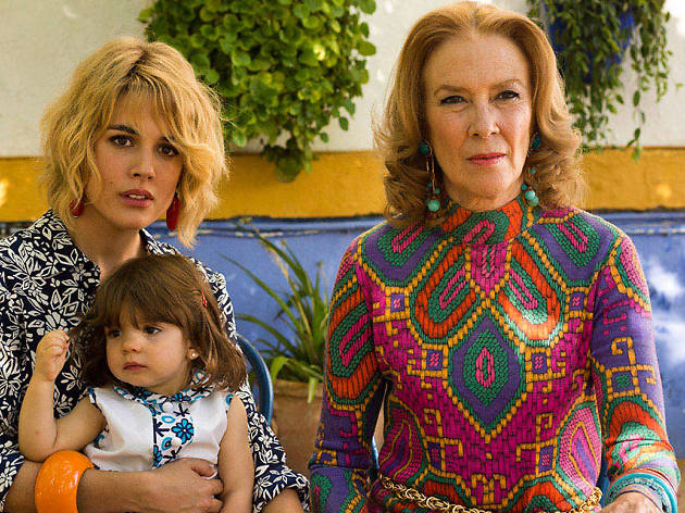 Julieta Two women and a young child in colourful clothing look into the distance