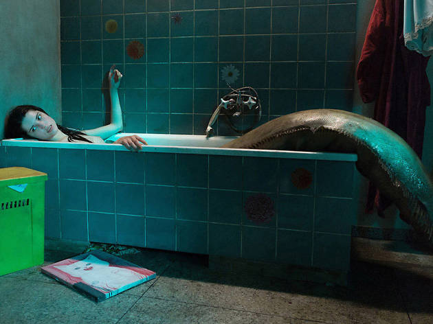 The Lure A mermaid-vampire stretches in a bathtub