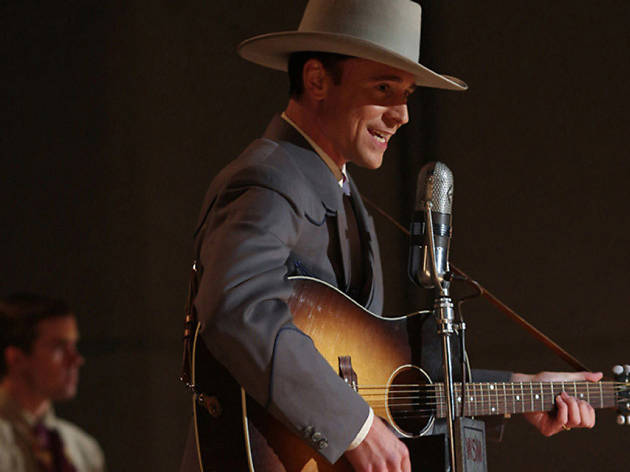 I Saw the Light Tom Hiddleston as a country singer in front of the microphone in I Saw the Light