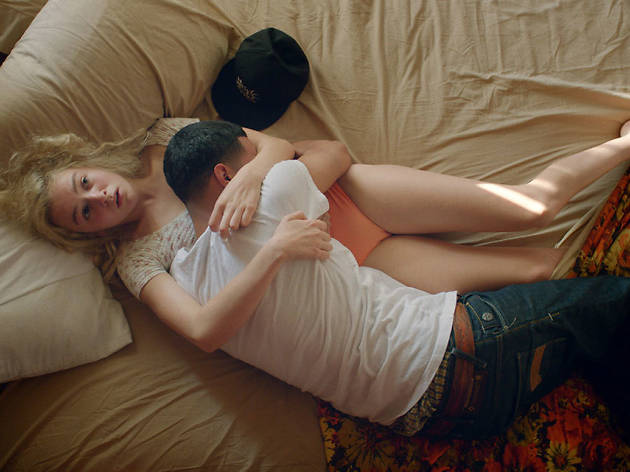 White Girl A young girl and boy lie in bed