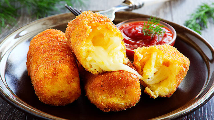 croquettes on a plate with sauce