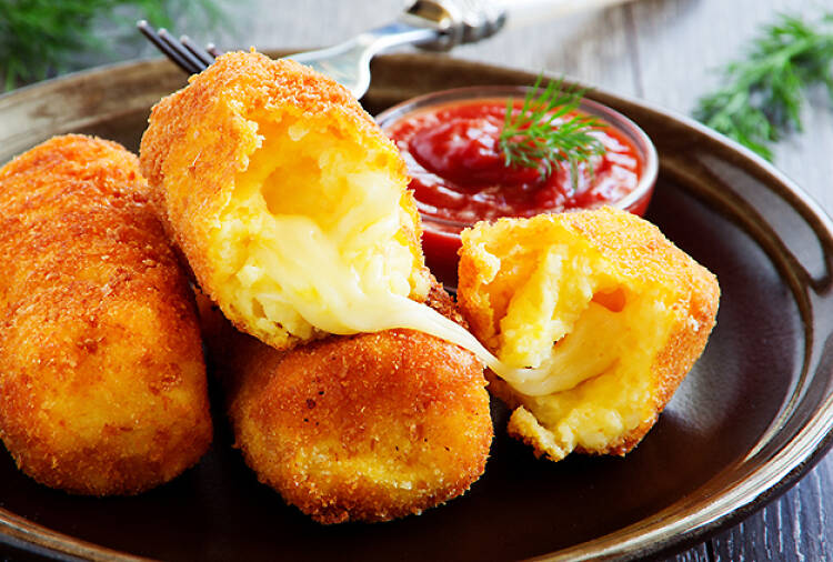 croquettes on a plate with sauce