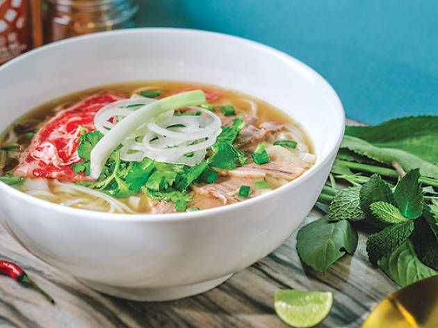 Bowl of pho Bowl of beef pho with noodles and herbs