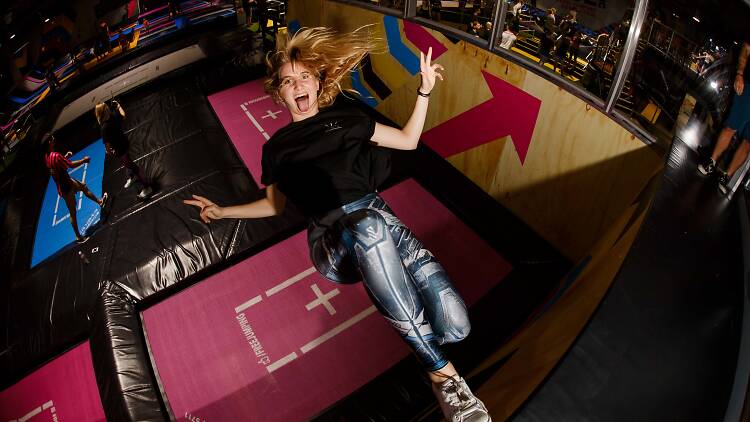 Jump around an indoor trampoline park