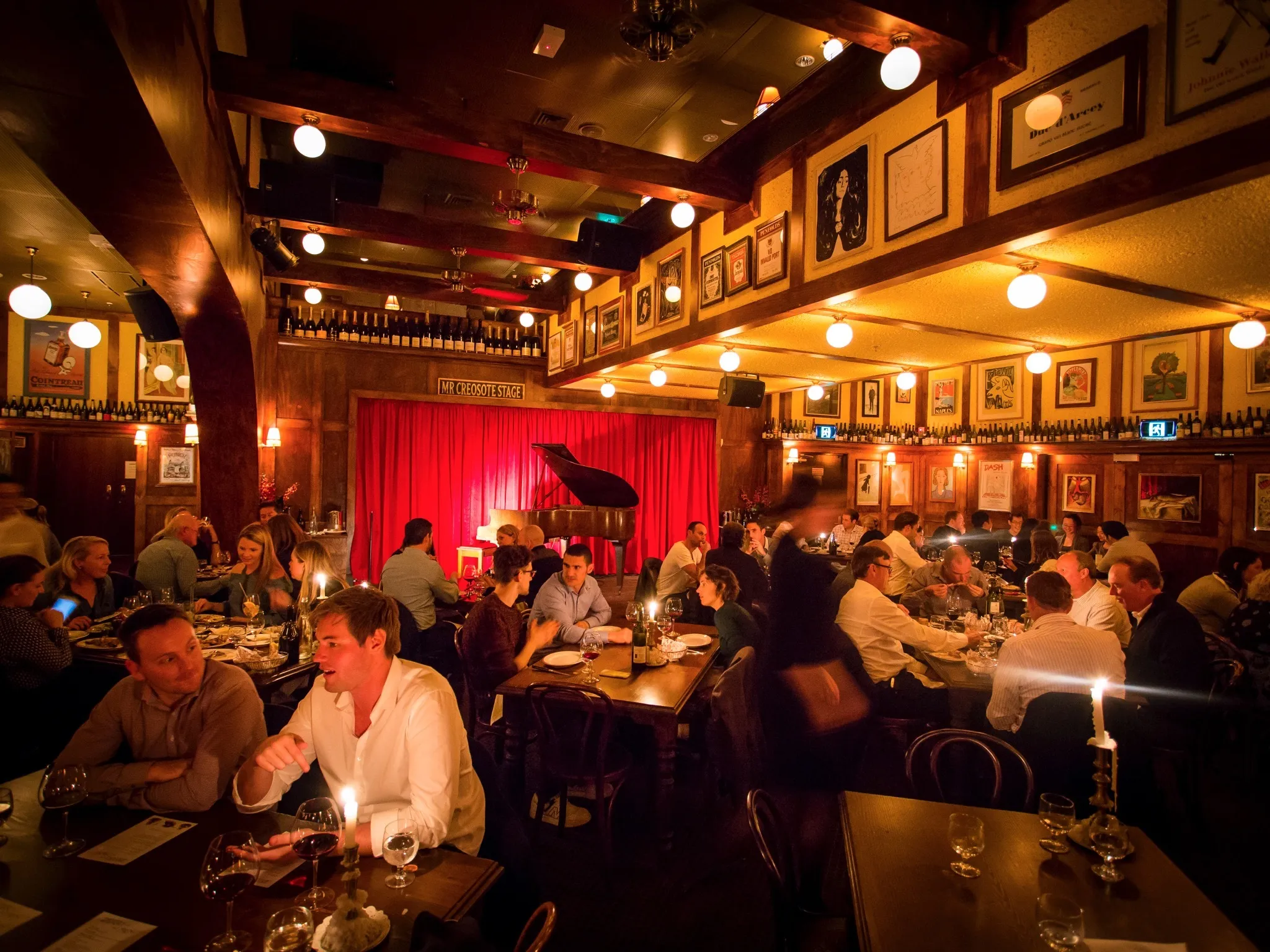 Interior with stage and piano at Hubert