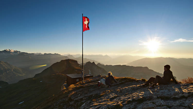 Swiss flag, mountain sunset, Bernese oberland