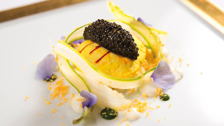 Poached saffron-flavoured organic egg with white asparagus and Oscietra caviar