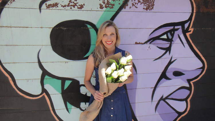 Courtney Ray holding a bunch of flowers